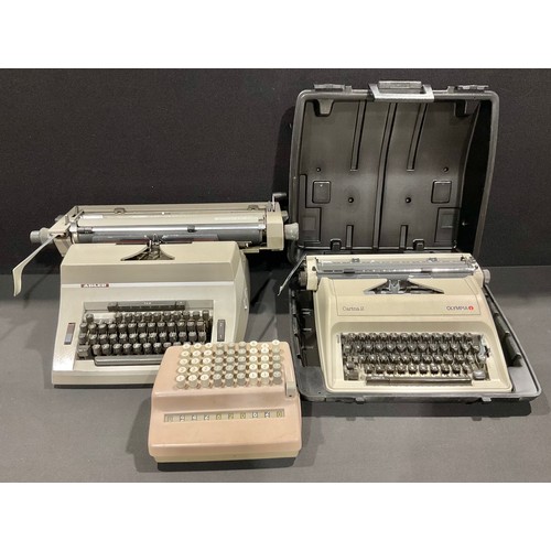 A Plus comptometer; an Adler Universal 390 office typewriter, made in ...
