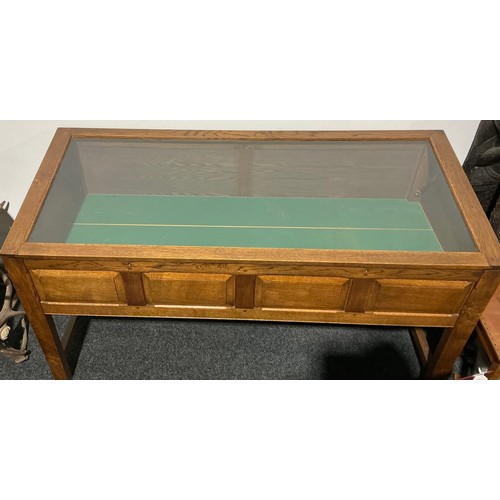 17 - An Arts & Crafts style oak bijouterie table, 100.5cm high, 176cm wide, 74cm deep