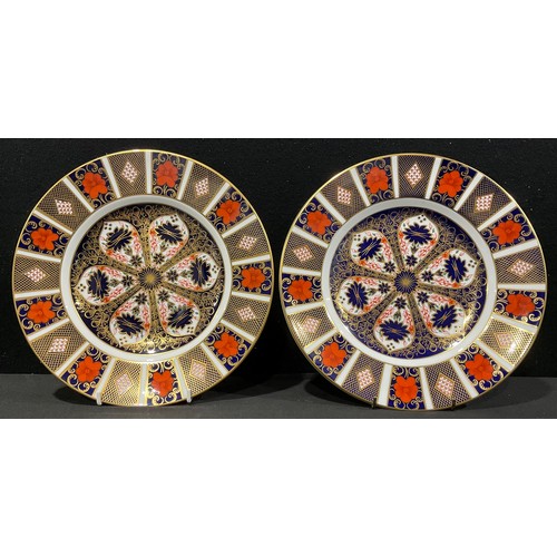 55A - A matched pair of Royal Crown Derby Imari 1128 pattern dinner plates, 27cm, one first quality, the o... 