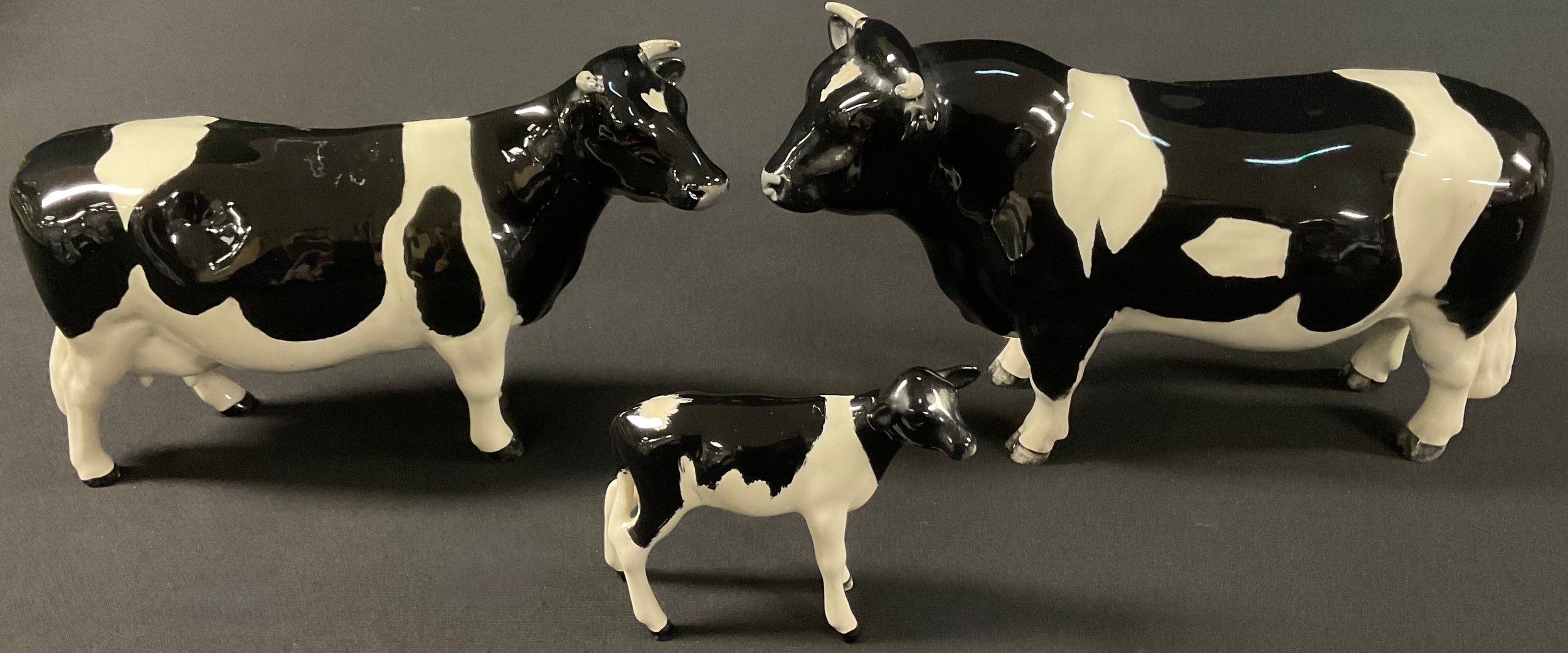 A Beswick cattle group, comprising Friesian Bull, Ch. Coddington Hilt ...