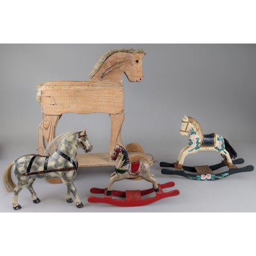 7346 - Juvenalia - an early 20th century stripped farmhouse pine child’s push along horse, sheep’s wool man... 