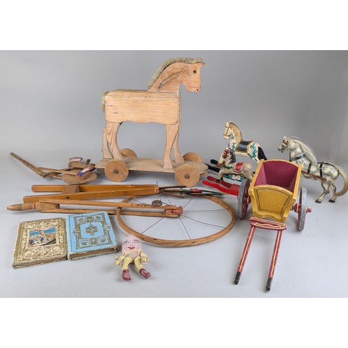 7346 - Juvenalia - an early 20th century stripped farmhouse pine child’s push along horse, sheep’s wool man... 