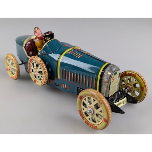 A tinplate clockwork racing car modelled as a Bugatti Type 35A, with ...