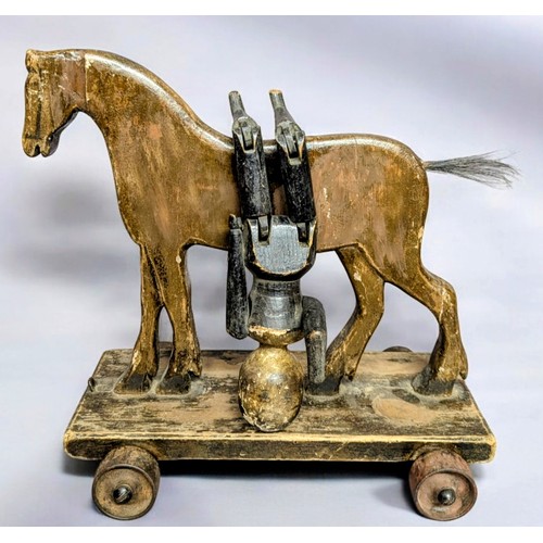 7350 - Juvenalia & Folk Art - a late Victorian pull along horse, horse hair tail, metal wheels, 37cm long, ... 