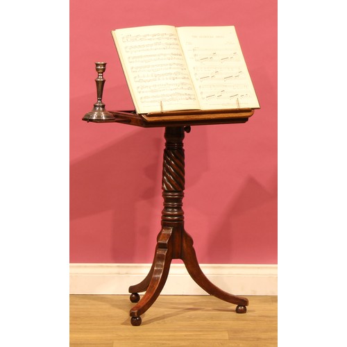 A 19th century mahogany tripod telescopic reading table, rounded ...