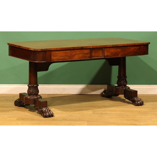 An early Victorian rosewood library table, rounded rectangular top ...