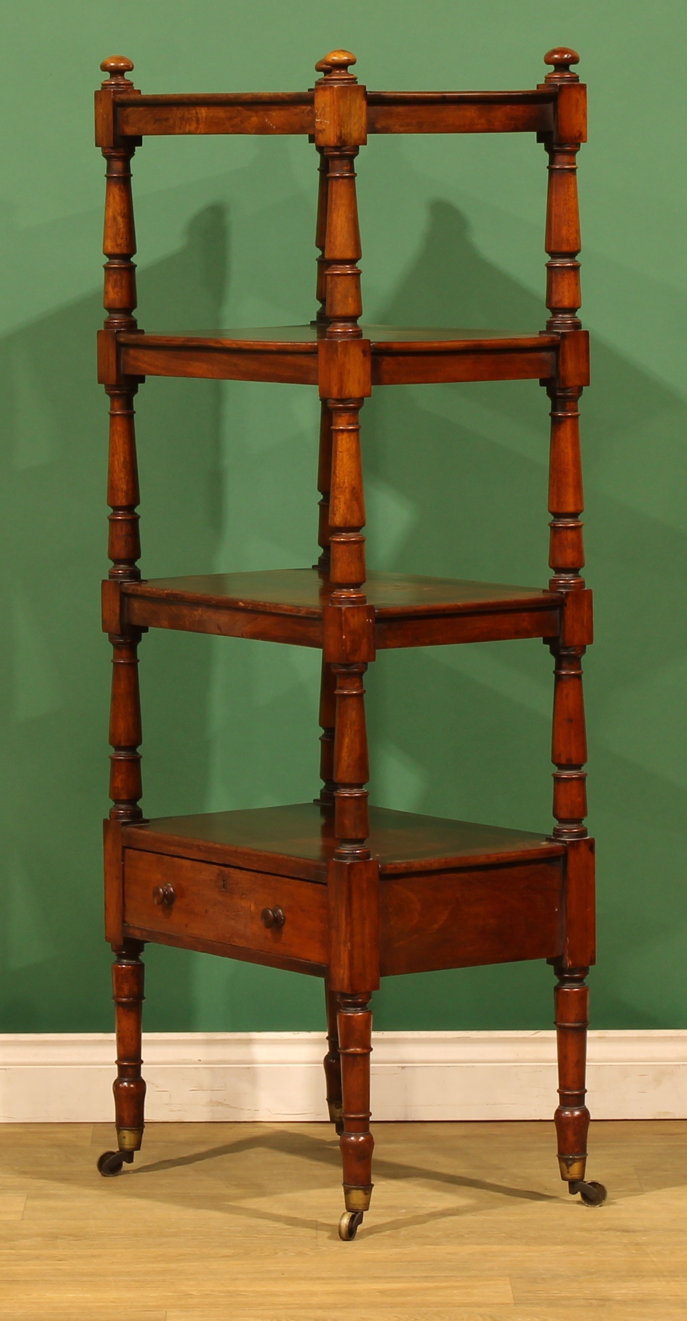 An early Victorian mahogany four-tier whatnot, rectangular plateaux ...