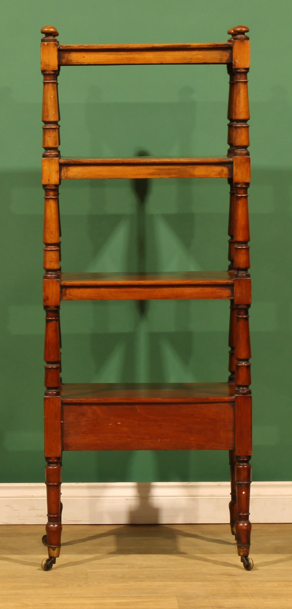 An early Victorian mahogany four-tier whatnot, rectangular plateaux ...