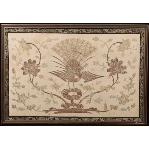 1313 - An early 20th century Chinese silk and metal stitch textile panel, worked with a fenghuang and flowe... 