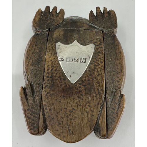 A 19th century fruitwood novelty snuff box, as a toad, glass eyes ...