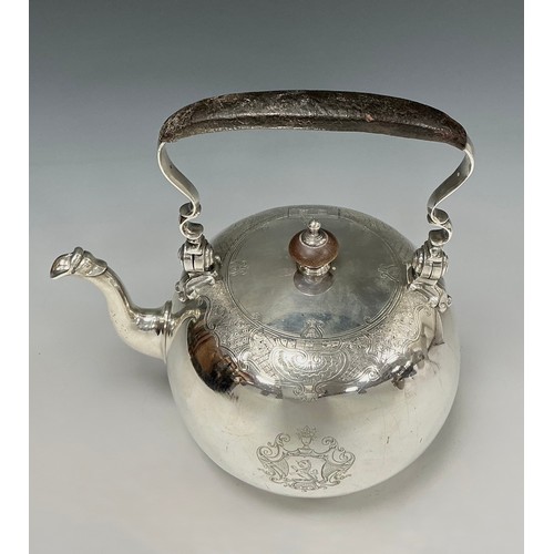 55 - A George II silver compressed globular tea kettle on stand, flush-hinged cover within an engraved Ro... 