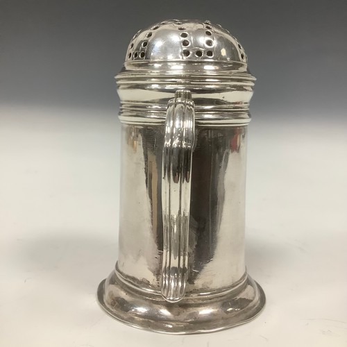 52 - A George II provincial silver bun top kitchen pepper, scroll handle, skirted base, 8cm high, John La... 