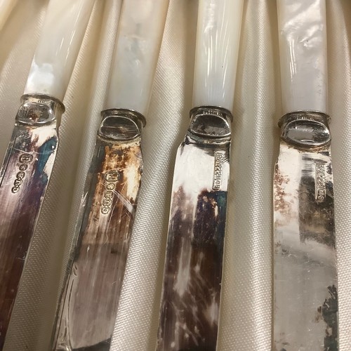 42 - An early 20th century E.P.N.S and faux mother of pearl fruit service, comprising twelve pairs of kni... 