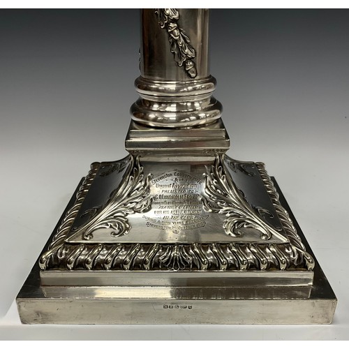 45 - An early 20th century E.P.N.S table lamp, spreading square base with stiff acanthus to angles, 55cm ... 