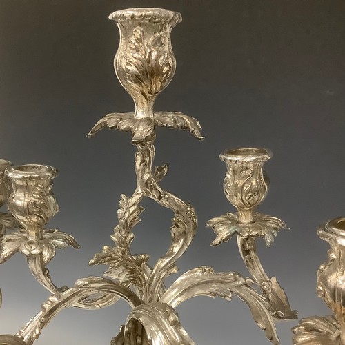 25 - A pair of 18th century style Rococo silver plated five-light table candelabra, cast throughout with ... 