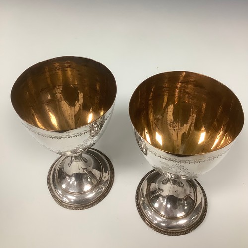 31 - A pair of George III Old Sheffield plate pedestal goblets, bright-cut engraved in the Neo-Classical ... 