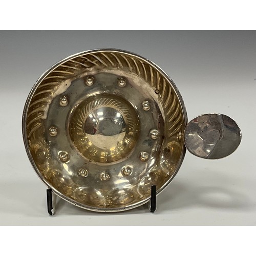 162 - A French silver wine taster, fluted border, loop handle with oval thumb-piece, 8.5cm diam, 19th cent... 
