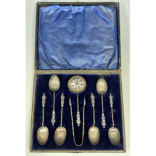 175 - A cased set of six Victorian silver shell bowl apostle spoons, straining spoon and sugar tongs, spir... 