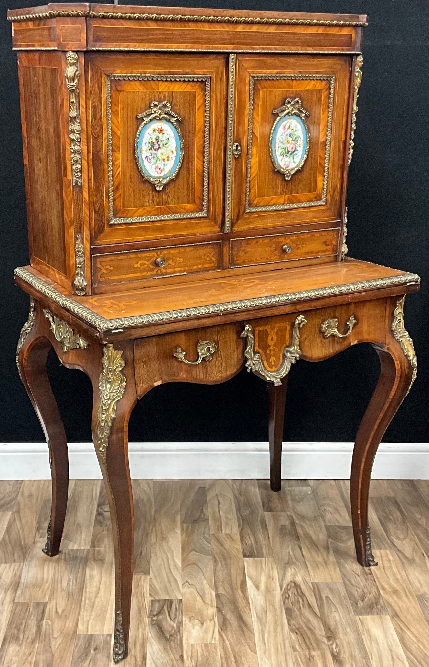 A 19th century French gilt metal and porcelain mounted kingwood bonheur ...