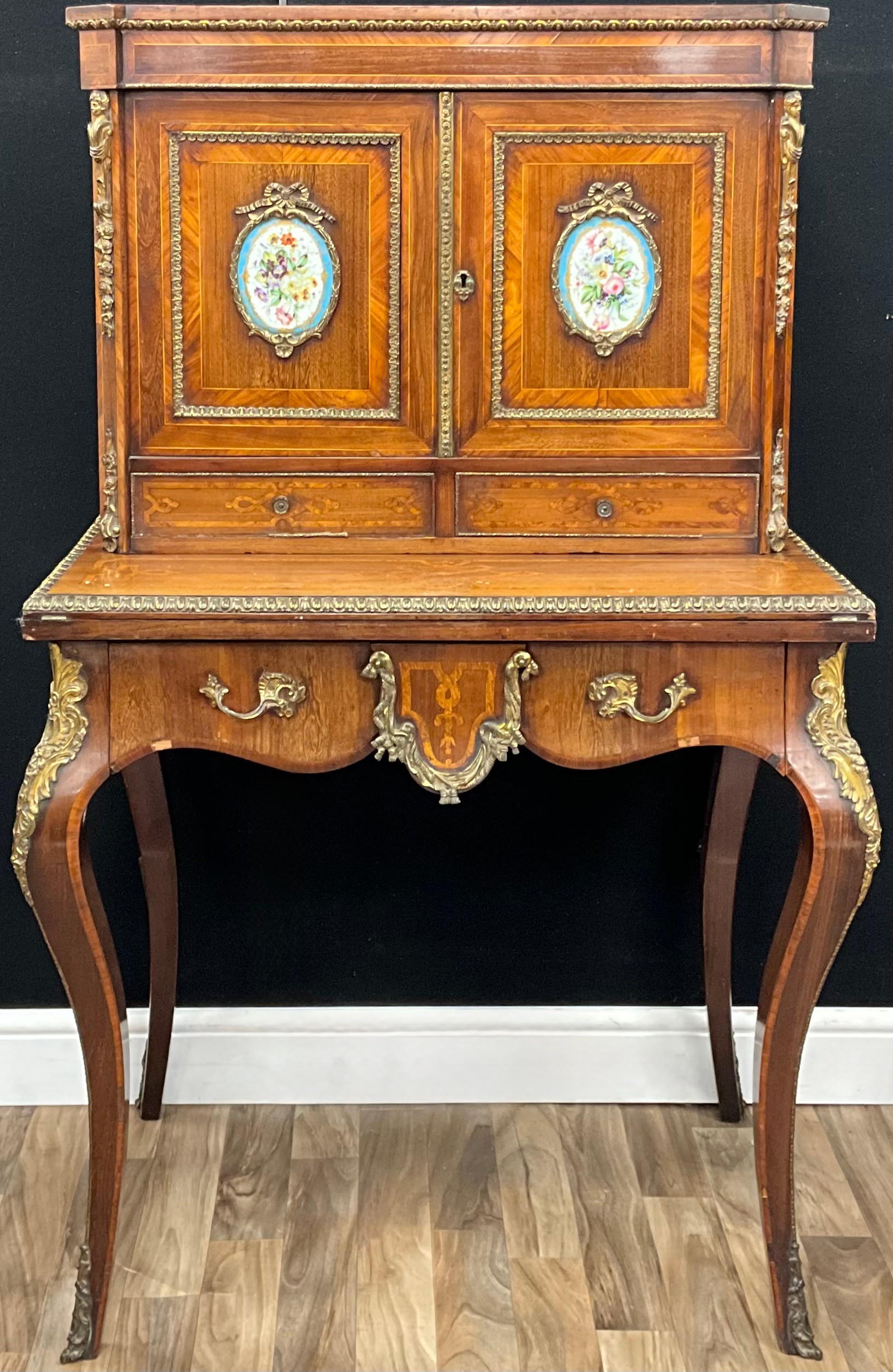 A 19th century French gilt metal and porcelain mounted kingwood bonheur ...