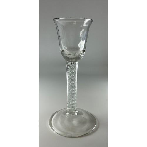 A George III opaque twist wine or cordial glass, bell shaped bowl,  double-helix stem, domed circular