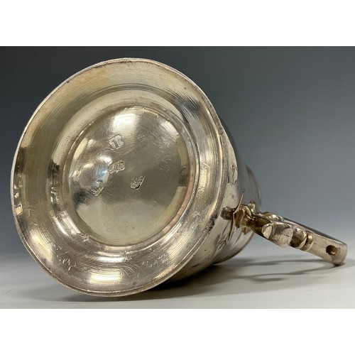 53 - A George II silver bell shaped half pint mug, capped double-scroll handle, skirted base, 10.5cm high... 