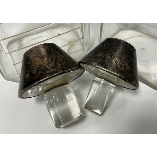129 - A pair of Victorian silver 'medicine bottle' decanters, cut level indicator notches, conical stopper... 