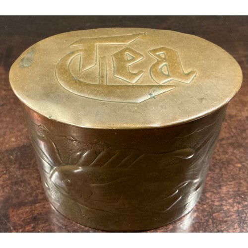 A Cornish Arts and Crafts copper oval tea caddy, repousse chased with ...