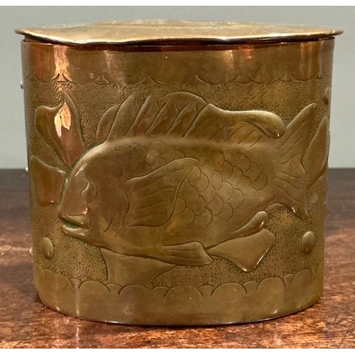 A Cornish Arts and Crafts copper oval tea caddy, repousse chased with ...