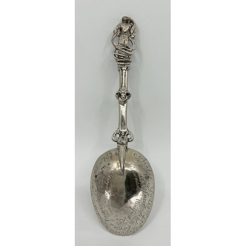 5 - An 18th century Continental spoon, probably Dutch, cast figural stem, the bowl inscribed to verso wi... 