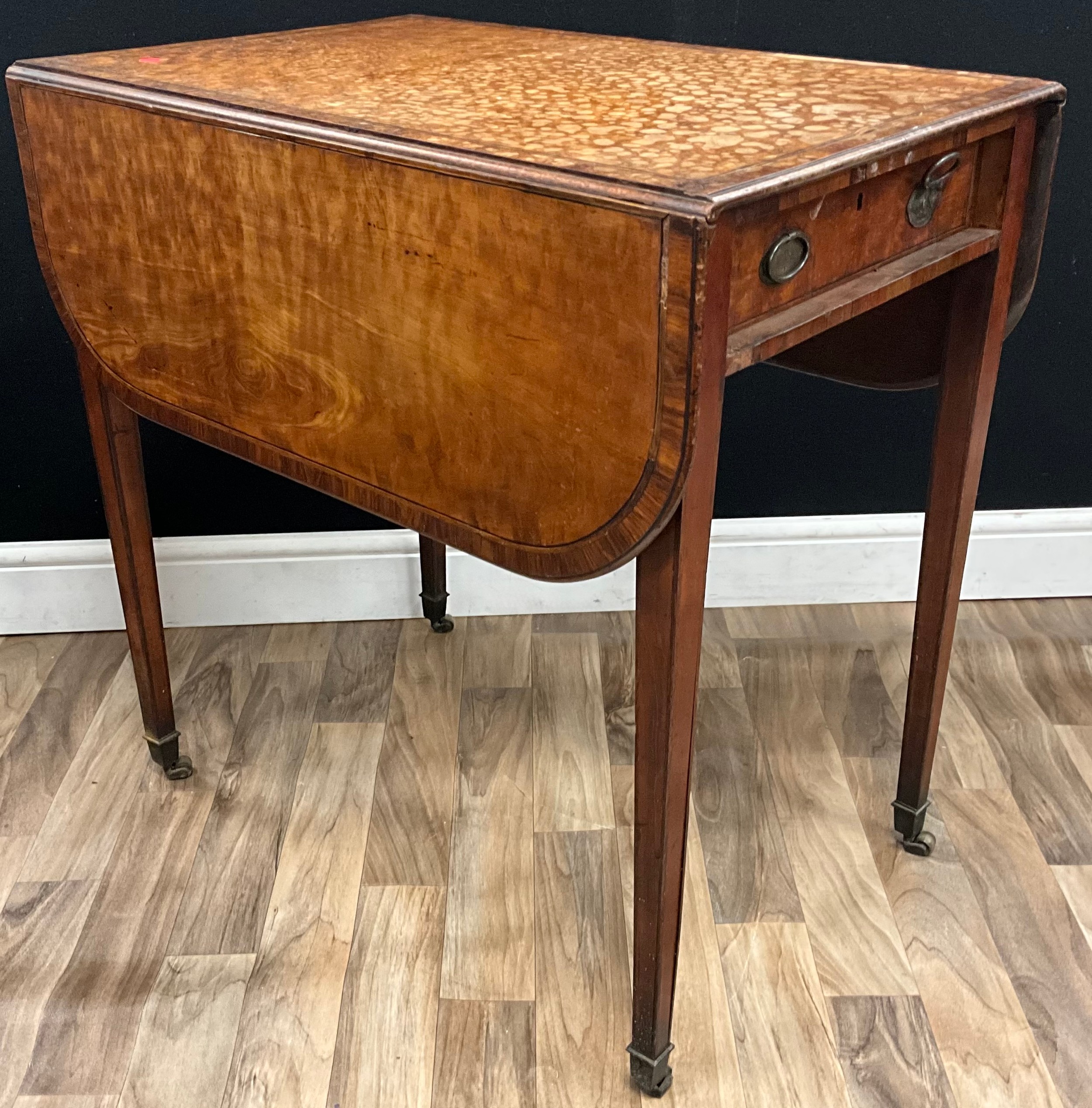 A George III Sheraton period satinwood Pembroke table, rounded ...