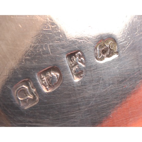 59 - A George II silver sauce boat, wavy rim, acanthus capped double-scroll handle, shell feet, 19cm long... 