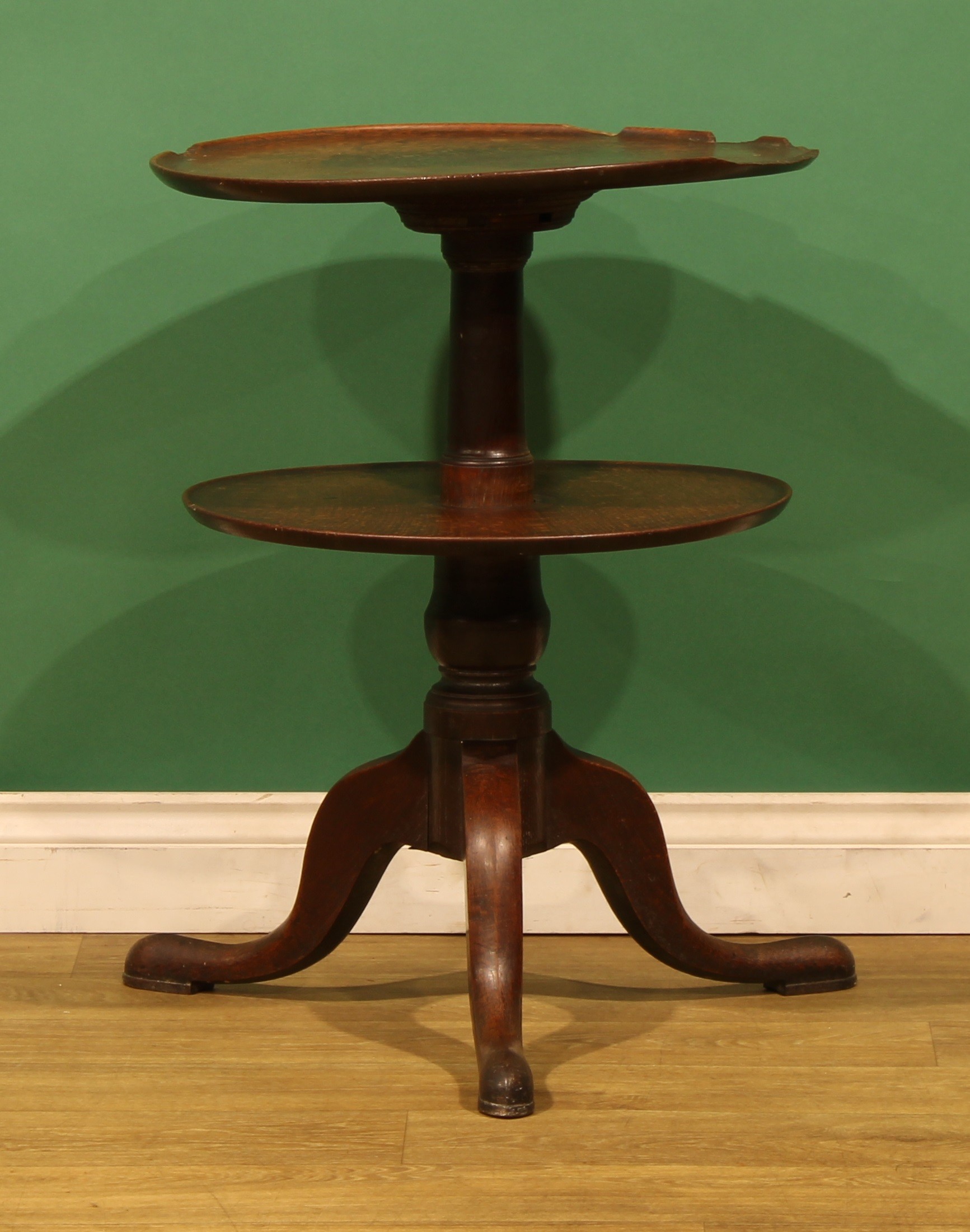 An unusual George III oak two-tier dumbwaiter, turned column, cabriole ...