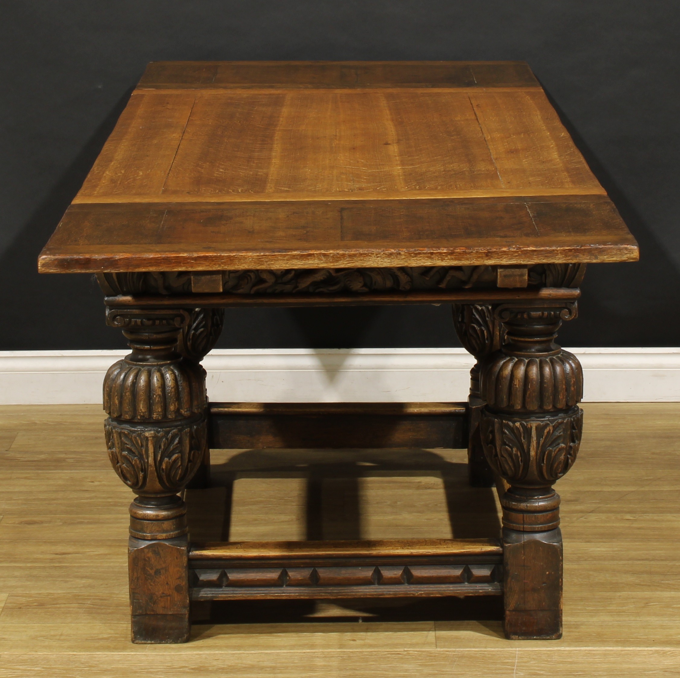 A 17th century style oak refectory table, rectangular top with draw ...