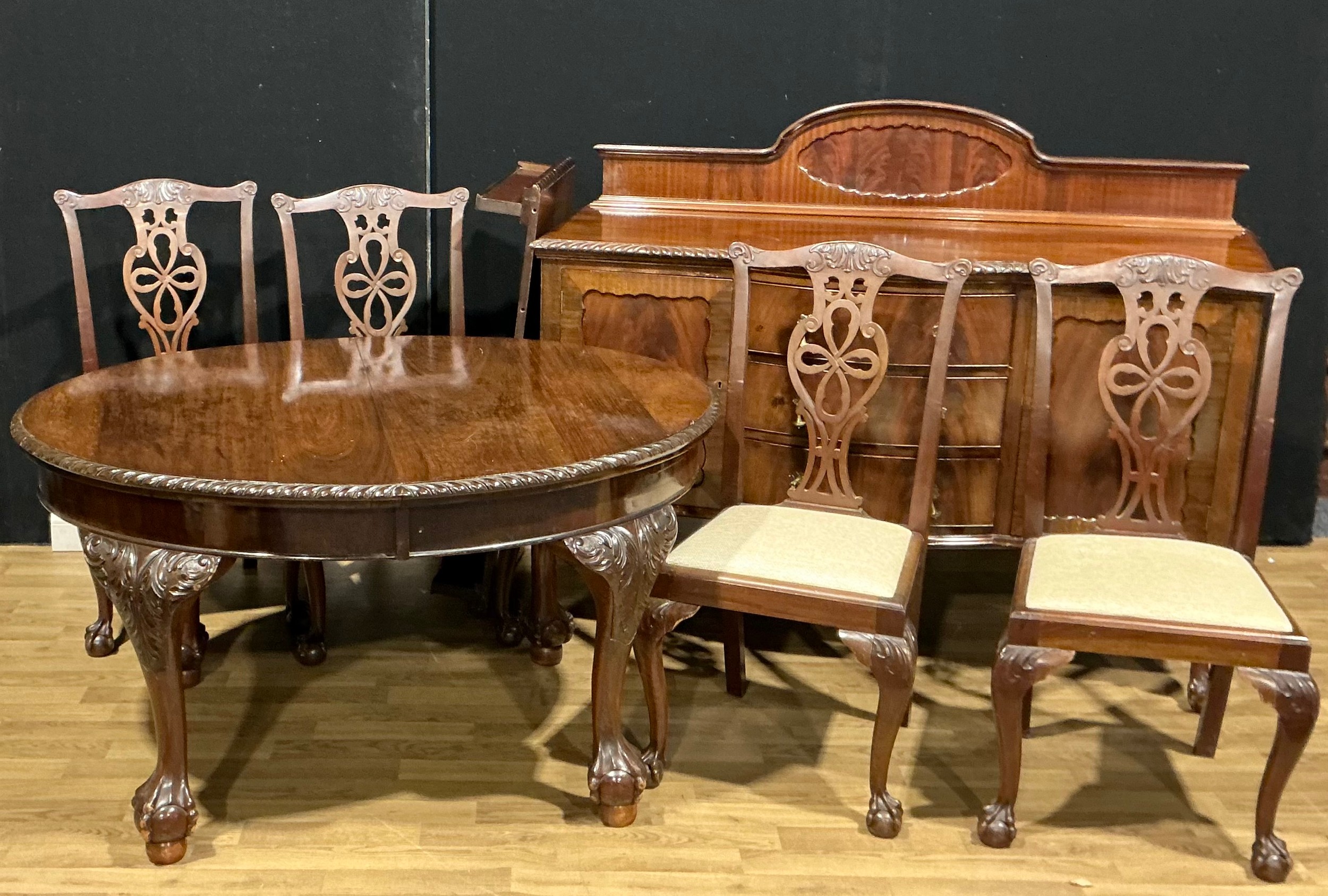 A George II style composed dining suite, comprising sideboard ...