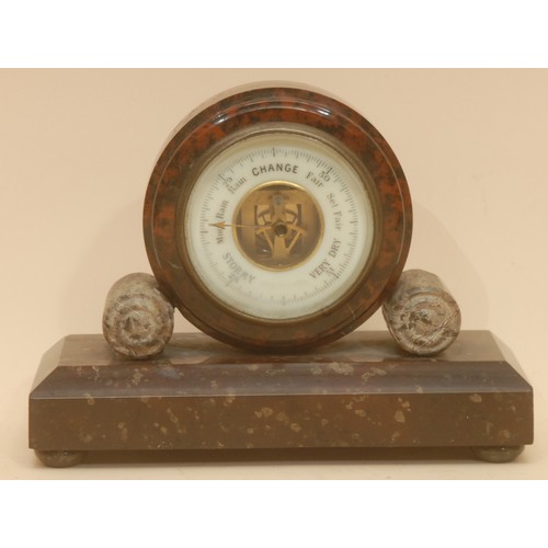 A Cornish serpentine aneroid barometer, 7cm register, rectangular base ...