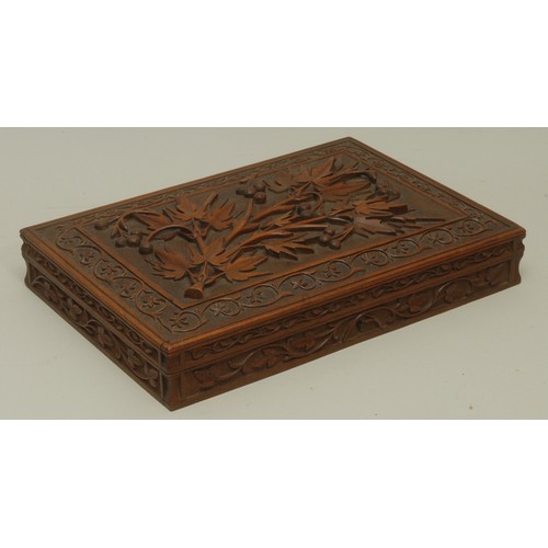 3590 - An Anglo-Indian Kashmiri hardwood rectangular armorial cigar box, hinged cover carved in bold relief... 
