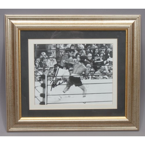 3370 - Sporting Memorabilia - a mid-century signed boxing photograph, showing Muhammad Ali vs Ken Norton II... 