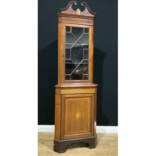 13 - An Edwardian Sheraton Revival satinwood crossbanded corner display cabinet, 209cm high, 67cm wide, 4... 