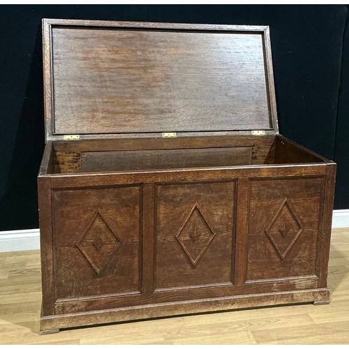 14 - A large 17th century style oak blanket chest, hinged top, the front applied with lozenge mouldings, ... 
