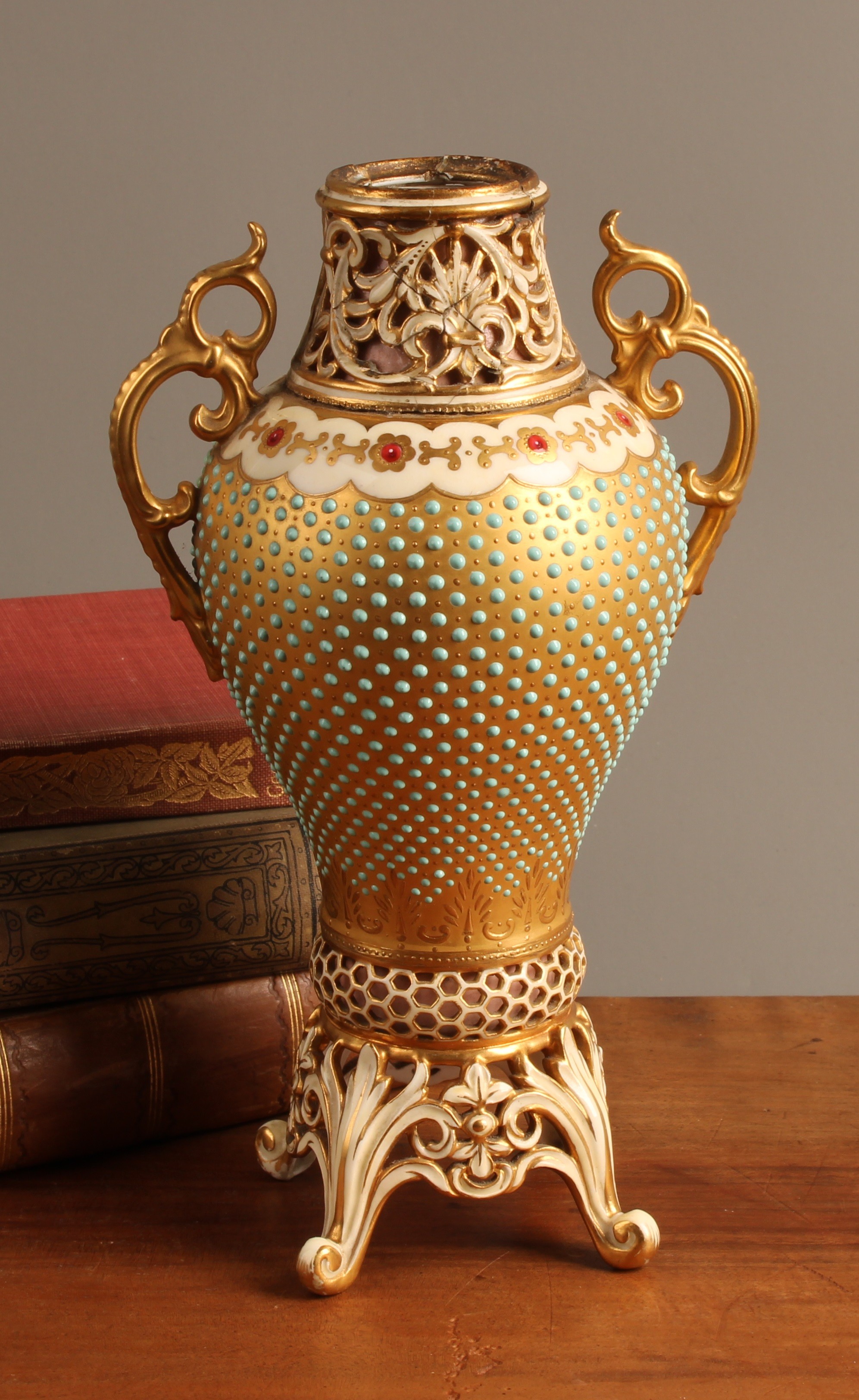 A Coalport two handled inverted baluster vase, applied with blue beads ...