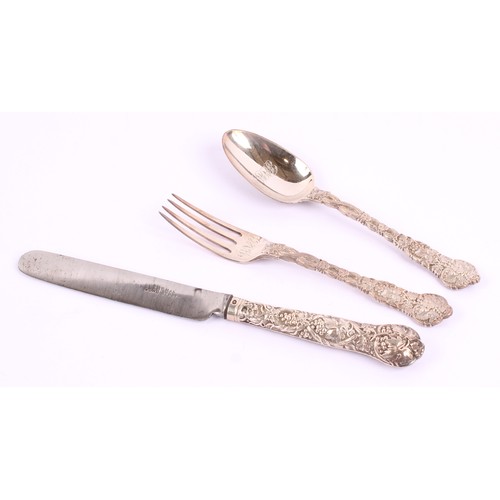 17 - A Victorian silver chased vine pattern Christening set, comprising spoon, knife and fork, the knife ... 