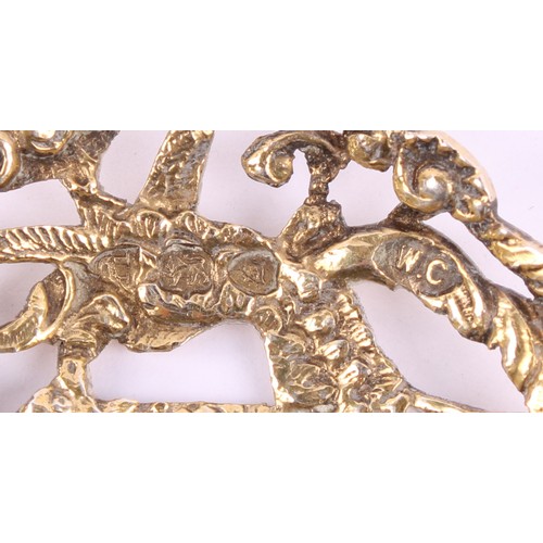 15 - A Victorian silver bon bon spoon, gilt heart shaped bowl, pierced and cast with a putto and scrollin... 