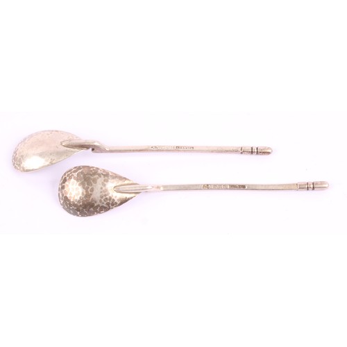 19 - Keswick School of Industrial Arts - a pair of Arts and Crafts silver spoons, planished pear shaped b... 