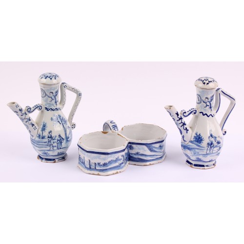 1009 - A Continental Delft oil and vinegar cruet set, comprising two bottles and a stand, the bottles 17.5c... 