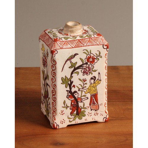 1010 - A Dutch Delft polychrome tea canister, in the chinoiserie taste, decorated with figures beside a flo... 