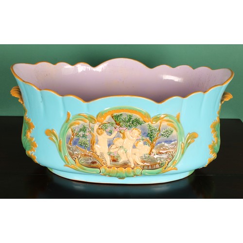 777 - A large Victorian Minton majolica lobed jardiniere, moulded with putti, leafy handles, turquoise gro... 