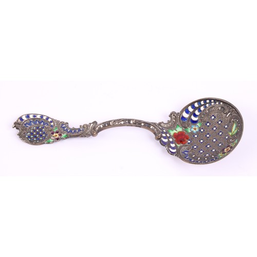 21 - A 19th century silver coloured metal and enamel spoon, probably Russian, in the Rococo taste, 11.5cm... 