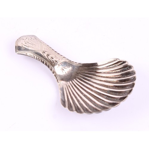 A George IV silver shell shaped caddy spoon, chased handle, 6.5cm long ...
