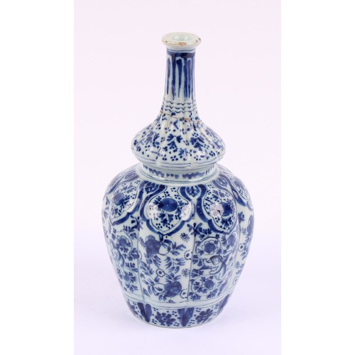 786 - An 18th century Delft lobed bottle vase, of double gourd form, decorated in underglaze blue in the C... 